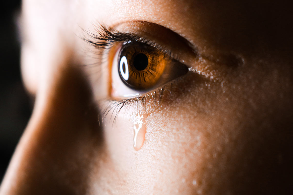 woman with teardrop in her eye
