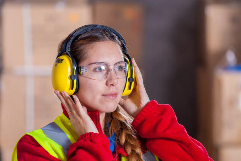 woman wearing googles and hearing protection