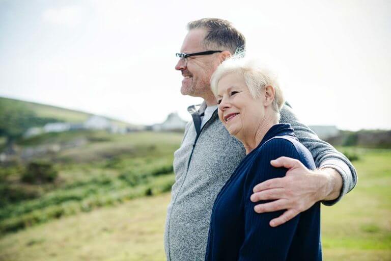 happy older couple on a hike